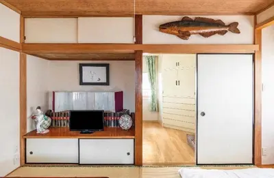 a room with a desk with a computer on it at \u677f\u6771\u30d3\u30eb in Tokyo