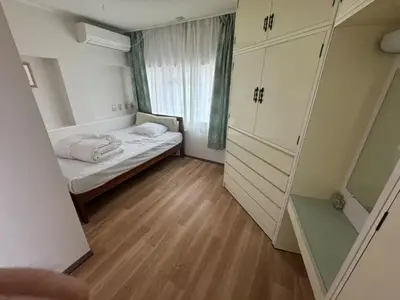 a small room with a bed and a window at \u677f\u6771\u30d3\u30eb in Tokyo