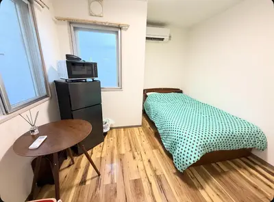 a small room with a bed and a table at Small stay in Tokyo in Tokyo