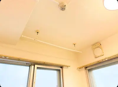 a room with two windows and a ceiling at Small stay in Tokyo in Tokyo
