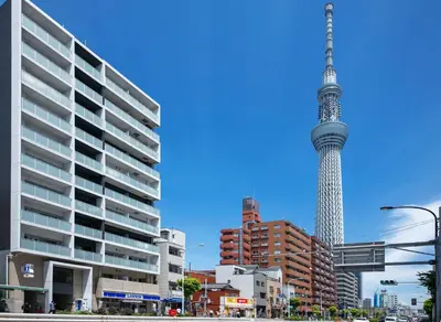 a view of the television tower in a city at \u3077\u3075\u304b\u6771\u99d2\u5f62 in Tokyo