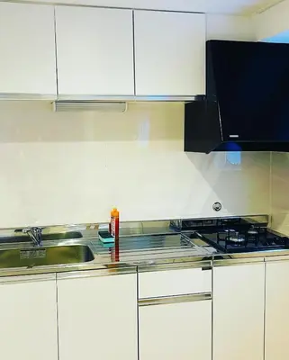 a kitchen with a sink and a stove at Home SHINJUKU west 101 in Tokyo
