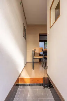 a room with a staircase with a table and chairs at Mikazuki Akabane/MA1 in Tokyo