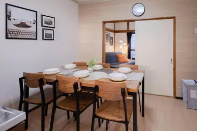 a dining room with a table and some chairs at Mikazuki Akabane/MA1 in Tokyo