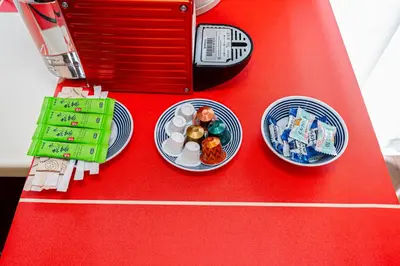 a toy kitchen with two plates of food on a red table at KYARA Hotel\u30df\u30b9\u30df401 in Tokyo