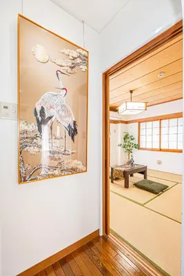 a room with a picture of a bird on the wall at KYARA Hotel\u30df\u30b9\u30df401 in Tokyo