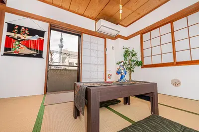 a dining room with a table and a window at KYARA Hotel\u30df\u30b9\u30df401 in Tokyo
