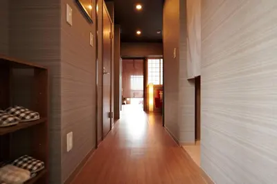 a hallway of a home with wooden floors and a hallway at \u7d44\u7d10\u306e\u9593 in Tokyo