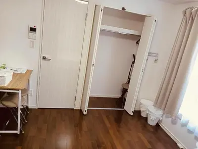 an empty room with a door and a desk and a table at KIYO Skytree Hotel \u9326\u7cf8\u753a\u99c5\u5f92\u6b69\uff13\u5206 in Tokyo