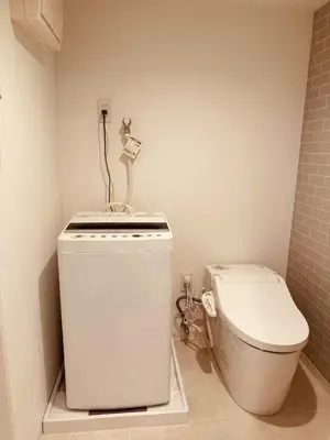 a small bathroom with a toilet and a sink at KIYO Skytree Hotel \u9326\u7cf8\u753a\u99c5\u5f92\u6b69\uff13\u5206 in Tokyo