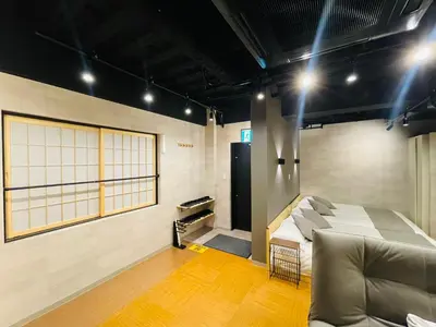 a room with a bed and a couch in it at IKEBUKURO TOKIWA 10 BUILDING 6min walk from Ikebukuro Station Direct access to the airport in Tokyo