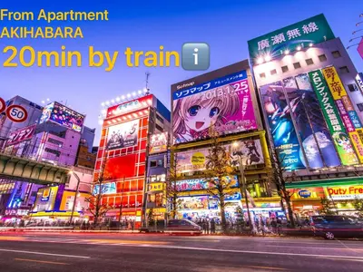 a city at night with illuminated signs on buildings at IKEBUKURO TOKIWA 10 BUILDING 6min walk from Ikebukuro Station Direct access to the airport in Tokyo