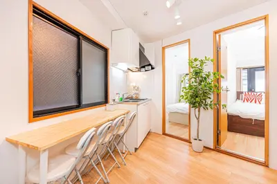 a kitchen and dining room with a table and chairs at Aurora 2 in Tokyo