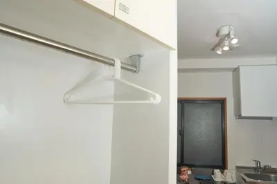 a kitchen with a light hanging from the ceiling at Aurora 2 in Tokyo