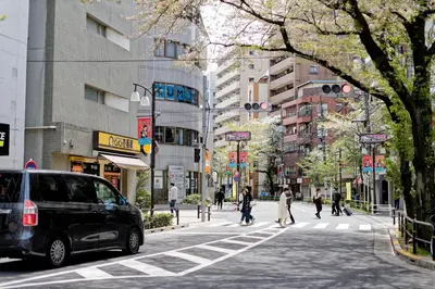 a city street with a van parked on the street at Tokyo Kitaku hotel in Tokyo