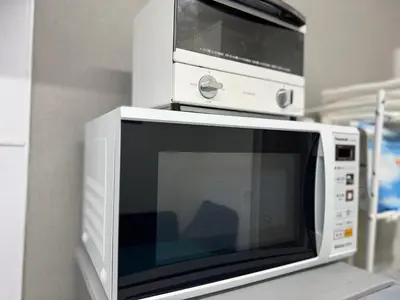 a microwave oven sitting on top of a counter at 2 bedrooms entire house in Tokyo