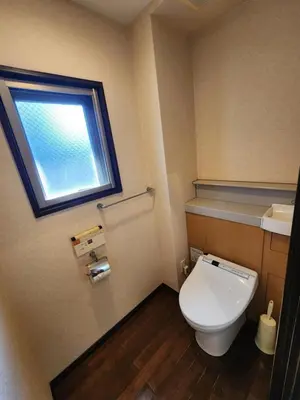 a small bathroom with a toilet and a window at LiVEMAX Claudia Akasakamitsuke in Tokyo