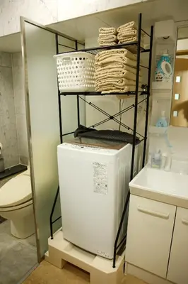 a laundry room with a washer and dryer at Toudaimae Mukougaoka Corpo #MTM in Tokyo