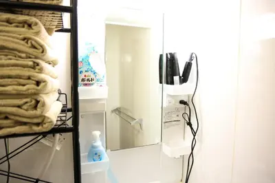 a bathroom with a mirror and a towel rack at Toudaimae Mukougaoka Corpo #MTM in Tokyo