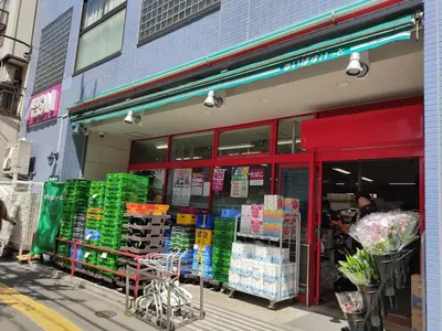 a store front of a grocery store with its doors open at Toudaimae Mukougaoka Corpo #MTM in Tokyo