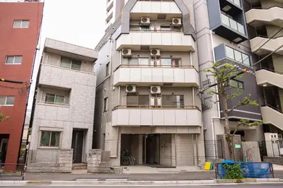 a tall building with two balconies on the side of it at Toudaimae Mukougaoka Corpo #MTM in Tokyo