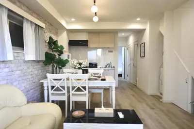 a kitchen and living room with a table and chairs at miyabi I - \u96c5 I in Tokyo