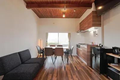 a living room with a couch and a table and chairs at V Close to Olympic Stadium Sendagaya Roof top Terrace in Tokyo