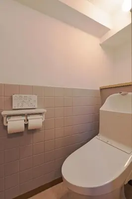 a bathroom with a toilet and some toilet paper at V Close to Olympic Stadium Sendagaya Roof top Terrace in Tokyo
