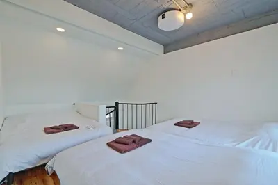 two beds sitting next to each other in a room at V Close to Olympic Stadium Sendagaya Roof top Terrace in Tokyo