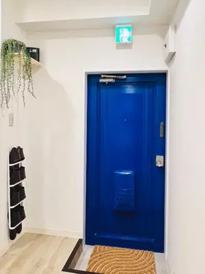 a blue door in the corner of a room at miyabi 3 - \u96c5 3 in Tokyo