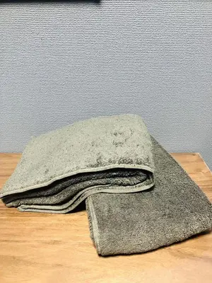 a pile of towels sitting on top of a table at 2nd house in Tokyo