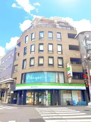 a tall brick building on a city street at Tokyo Holiday Hotel in Tokyo