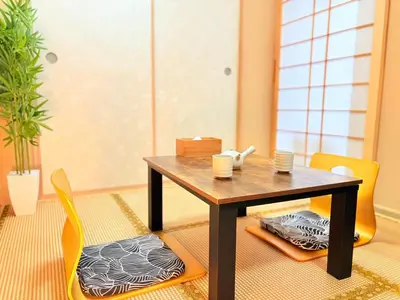 a dining room with a table and chairs at Tokyo Holiday Hotel in Tokyo