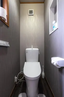 a bathroom with a white toilet in a room at 7House in Tokyo