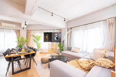 a living room with a couch and a table at Eminaz Minami Otsuka 2F in Tokyo