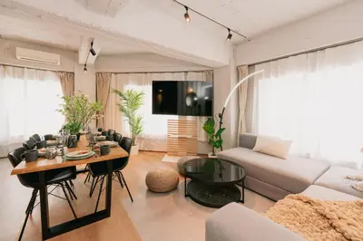 a living room with a couch and a table at Eminaz Minami Otsuka 2F in Tokyo