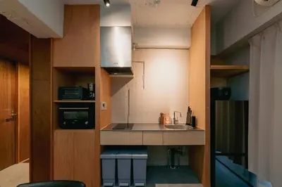 a small kitchen with a sink and a stove at Eminaz Minami Otsuka 2F in Tokyo