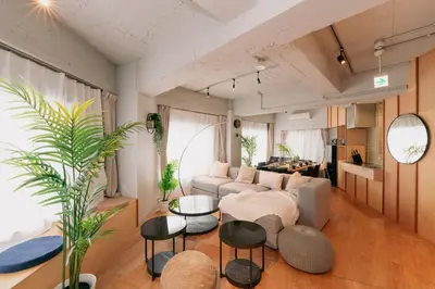 a living room with a couch and a table at Eminaz Minami Otsuka 3F4F in Tokyo