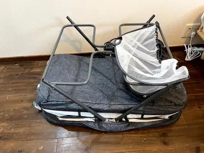 an open suitcase sitting on the floor on a wooden floor at Eminaz Minami Otsuka 3F4F in Tokyo