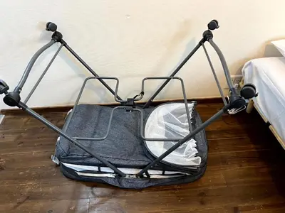 a suitcase sitting on the floor next to a bed at Eminaz Minami Otsuka 3F4F in Tokyo