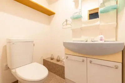 a bathroom with a toilet and a sink at 101 Shinjuku Modern Apartment Triple Station Access Free Wi-Fi in Tokyo