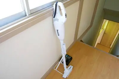 a hair dryer hanging on the corner of a room at \u6885\u5c4b\u6577\u8cb8\u5bb6 in Tokyo