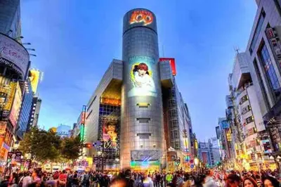 a crowd of people standing in front of a building at Shibuya sta 3min\u30fbcenter area\u30fbSwitch\u30fbPocket Wi-Fi in Tokyo
