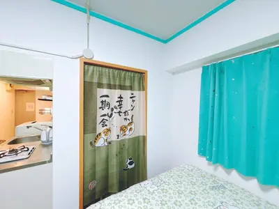 a small room with a bed and a kitchen at 403, Shinjuku City, JR Yamanote Line, 6 min walk to stn in Tokyo