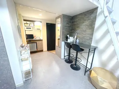 a small kitchen with a black table and a counter at Ikejiri Ohashi Sta 10min walk,Nakameguro 10 min walk,Switch in Tokyo