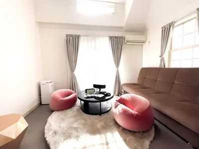 a living room with two red chairs and a couch at Ikejiri Ohashi Sta 10min walk,Nakameguro 10 min walk,Switch in Tokyo