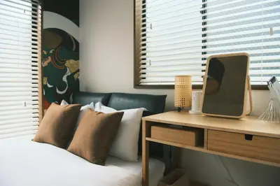 a bedroom with a bed and a tv on a table at Ukiyoan Kachofugetsu in Tokyo