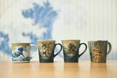 a group of four coffee mugs sitting on a table at Ukiyoan Kachofugetsu in Tokyo