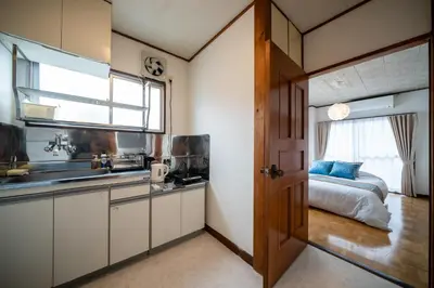 a kitchen with a sink and a bed in a room at Lucky Horikiri - \u30e9\u30c3\u30ad\u30fc\u5800\u5207 in Tokyo