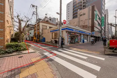 an empty street with a crosswalk in a city at KYARA HOTEL\u3000\u4e80\u6238502 in Tokyo